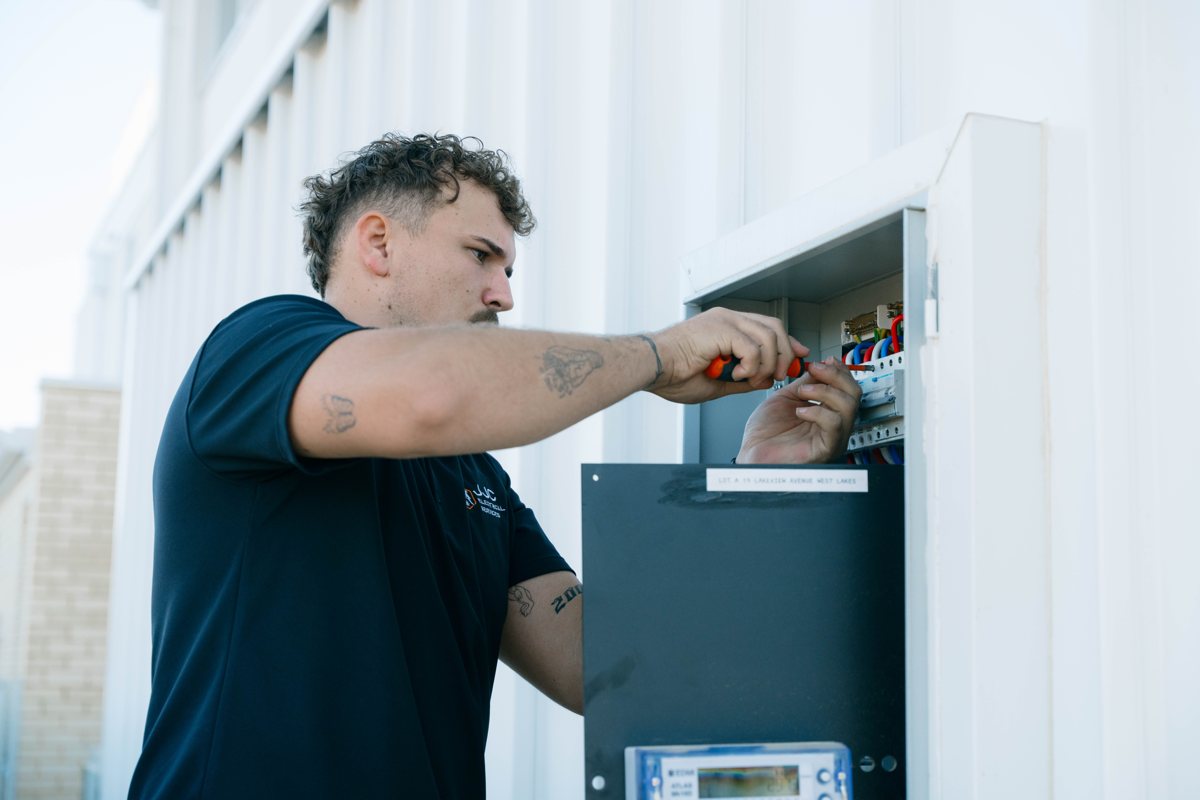JJC electrician at a switchboard